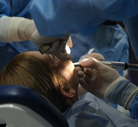 Woman getting oral surgery