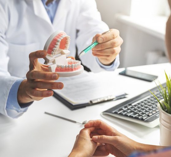 a dentist talking about dental care with a patient